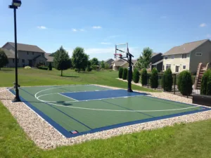 Backyard basketball court with black outdoor light