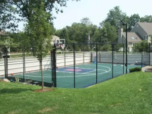 Outdoor basketball court with custom red logo