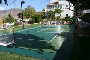Backyard futsal and basketball court combination by Sport Court