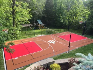 Outdoor residential multi-sport court with Indiana University logo