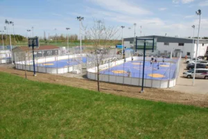 Blue and yellow outdoor roller sports courts at a facility