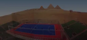 Outdoor futsal court in the middle of the desert with pyramids