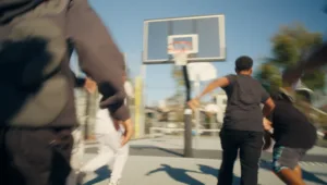 Kids running toward a hoop, blurry