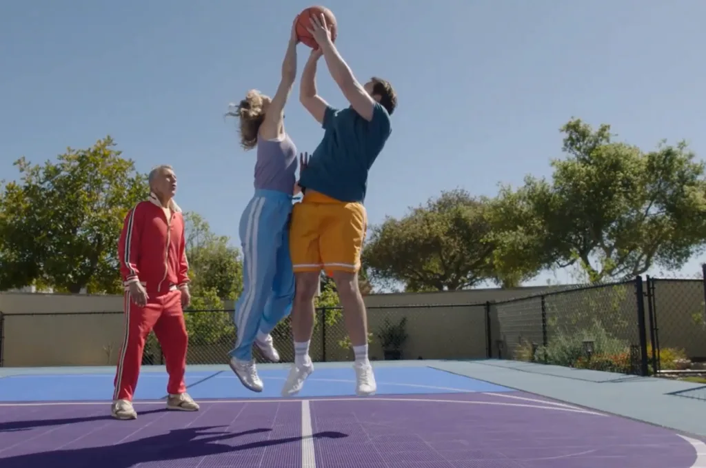 Mother blocking a father's jump shot